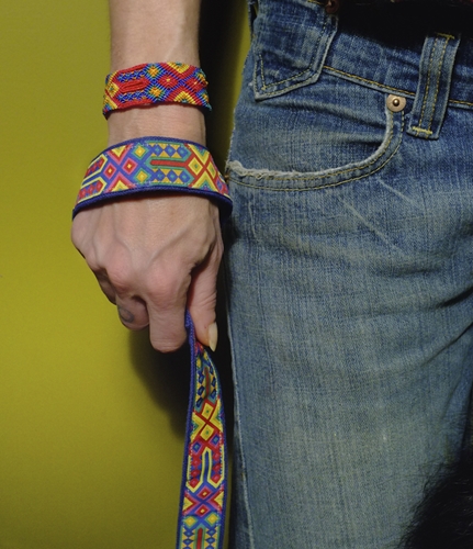 person wearing speck friendship bracelet and holding matching hemp dog collar
